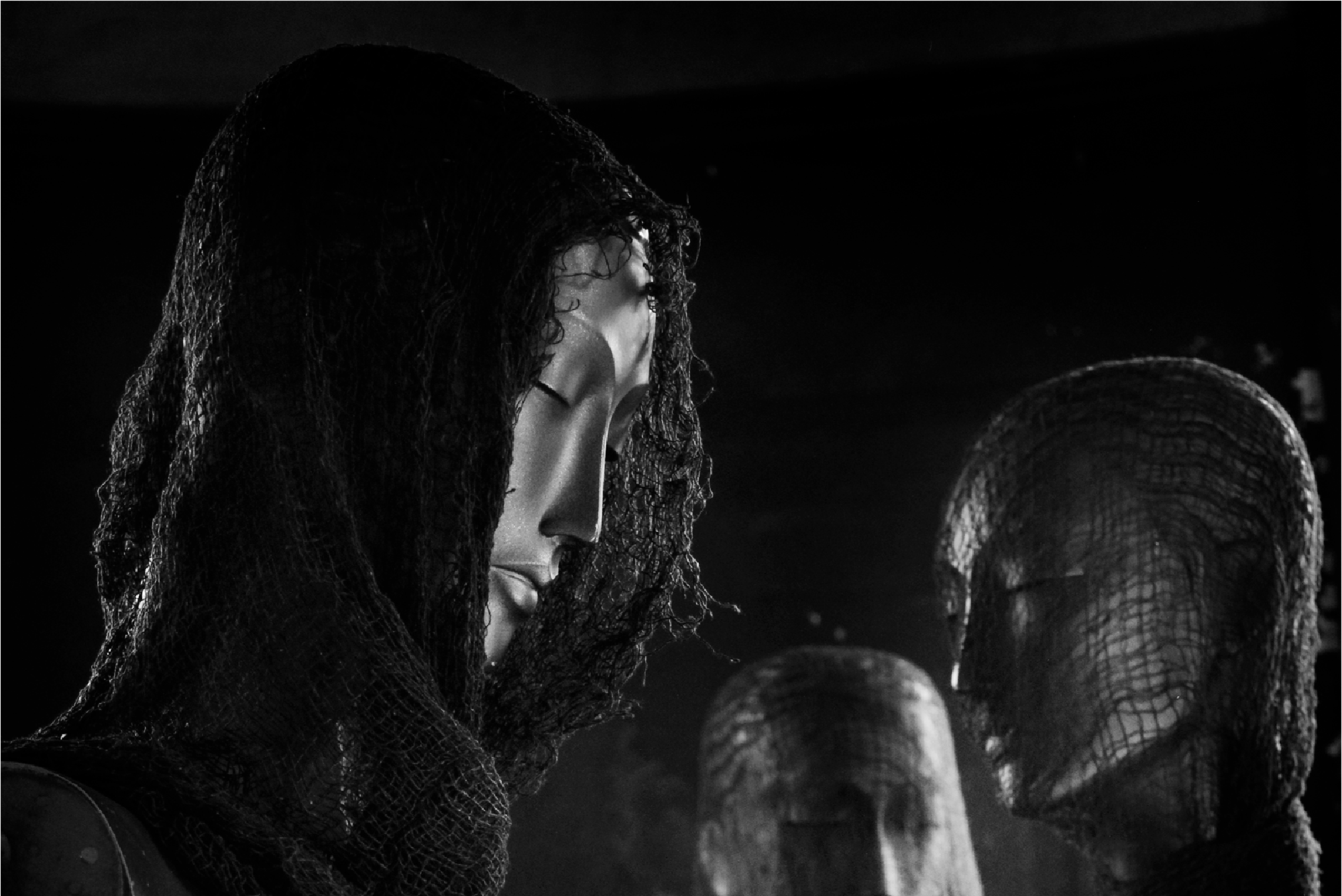 Spooky mannequins in a dark room