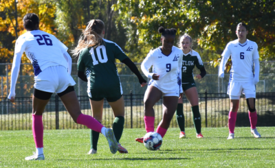 Number 9, Shaniah Johnson kicks the ball.