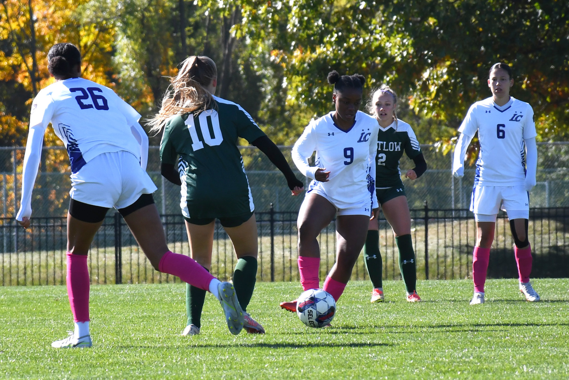 Number 9, Shaniah Johnson kicks the ball.
