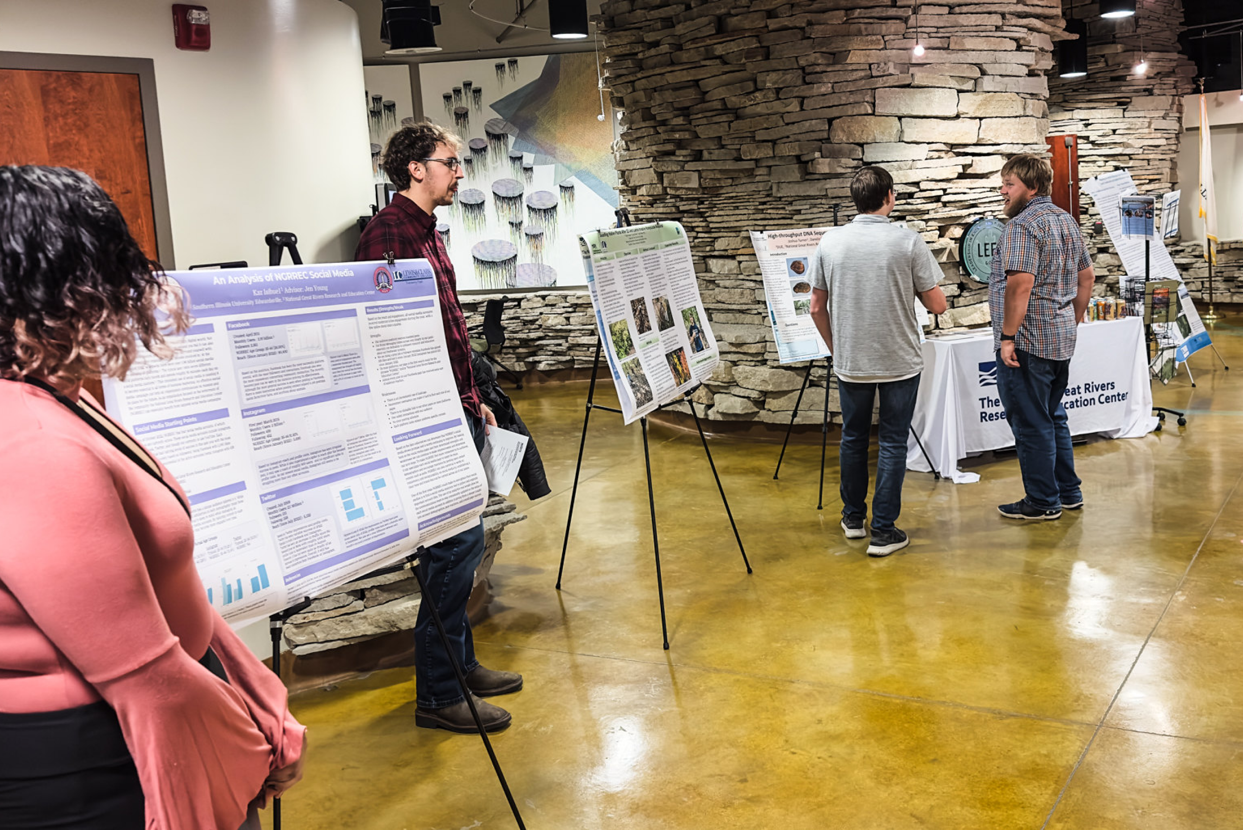 Interns lined up to talk about their projects before presentations start.