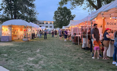 fair goers check out tents