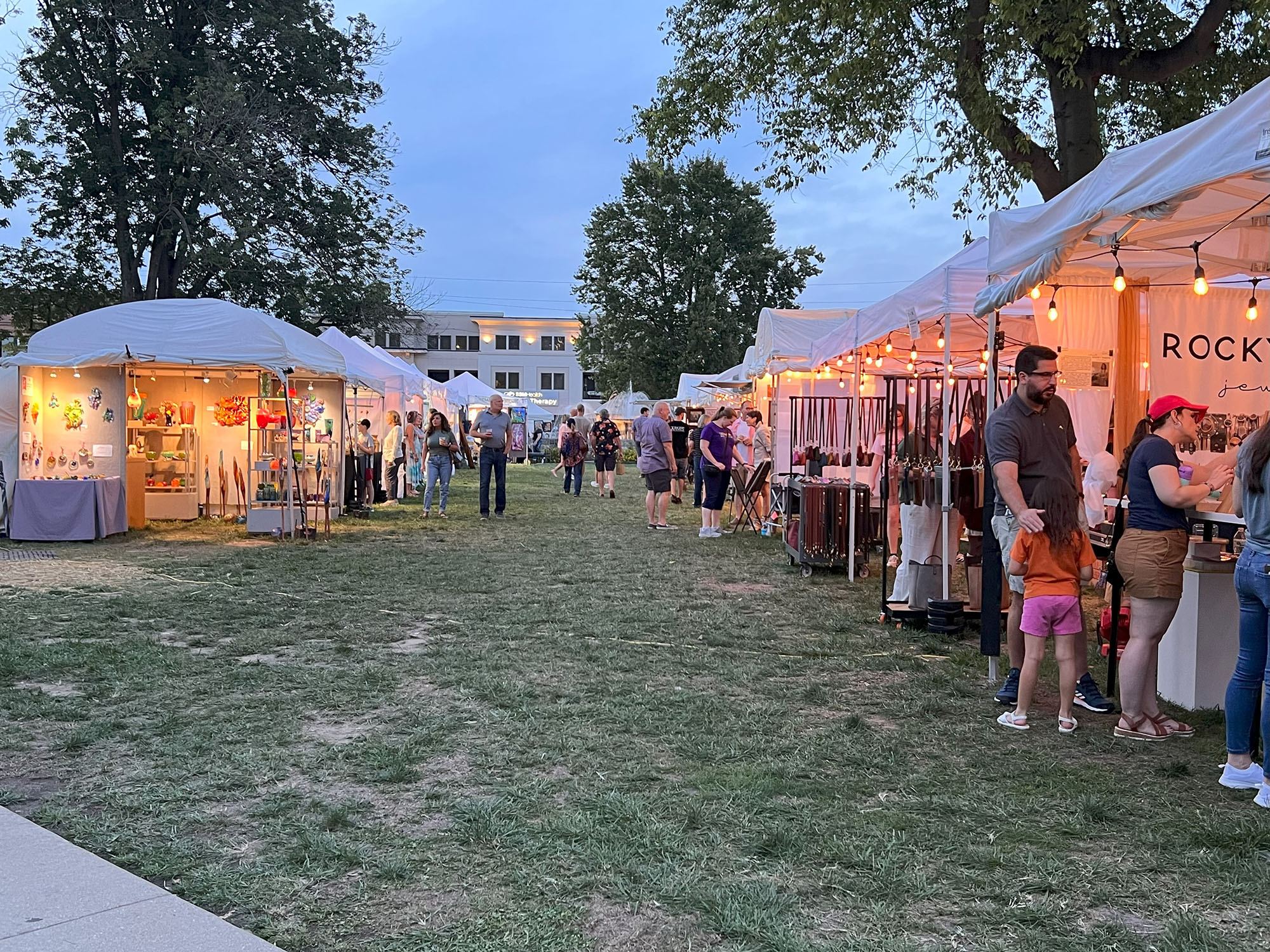 fair goers check out tents