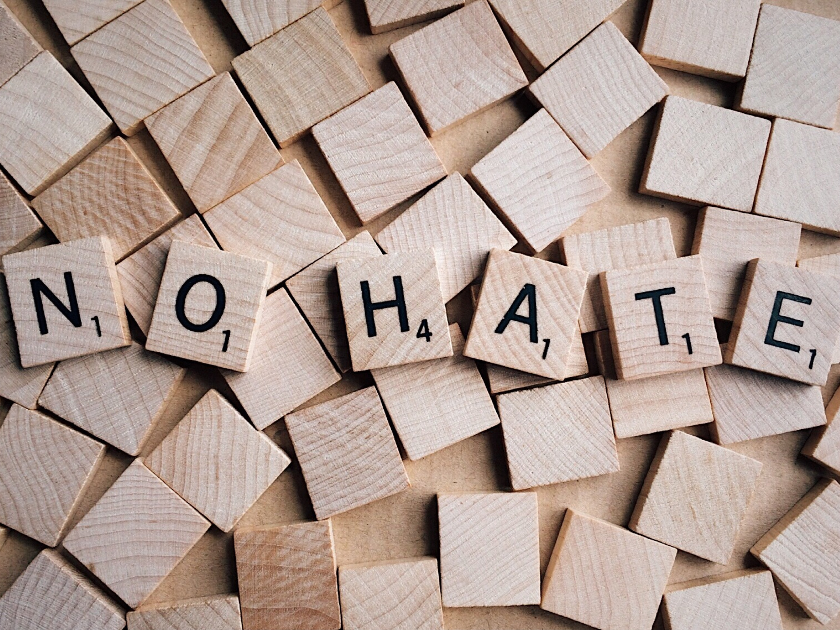 scrabble letters spelling "No Hate"