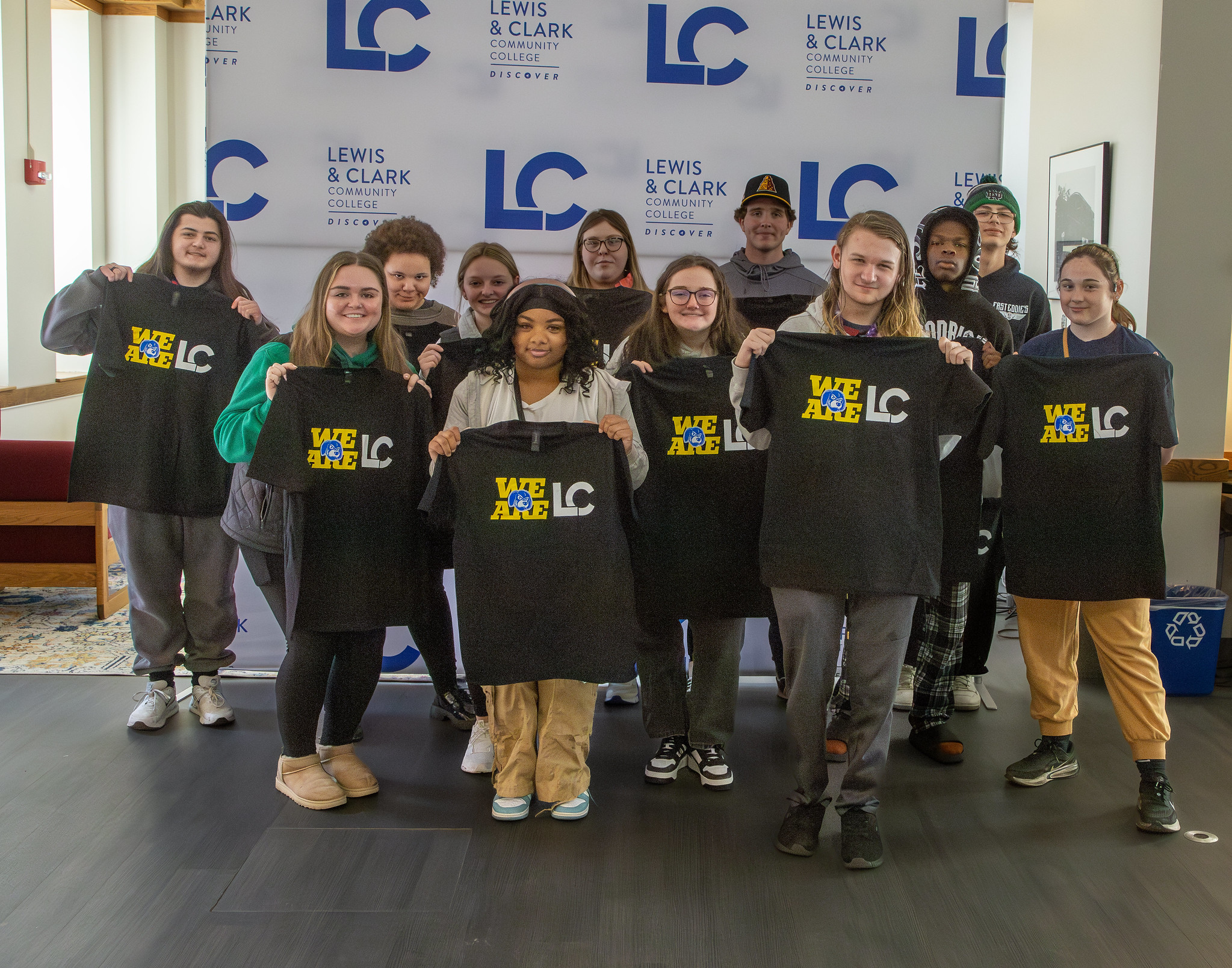 New L&C students holding school shirts